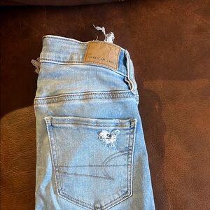 Distressed Light Blue Jeans American Eagle
